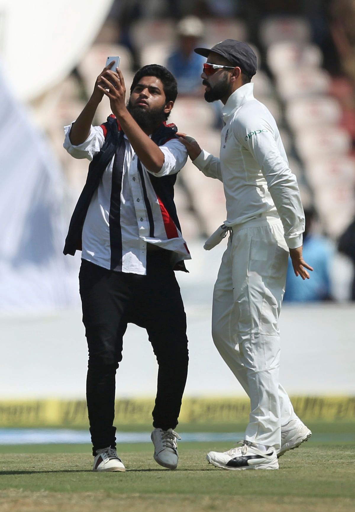 Fans breaching security cordon to get up close with Virat Kohli is becoming a new norm.