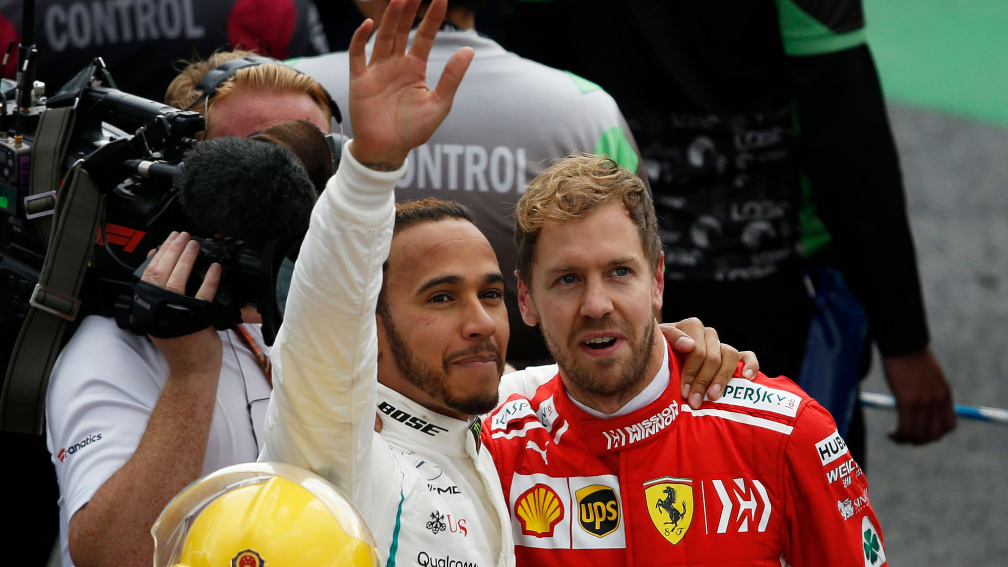Mercedes driver Lewis Hamilton, of Britain, and Ferrari driver Sebastian Vettel, of Germany, right, embrace at the end of the Formula One Mexico Grand Prix.