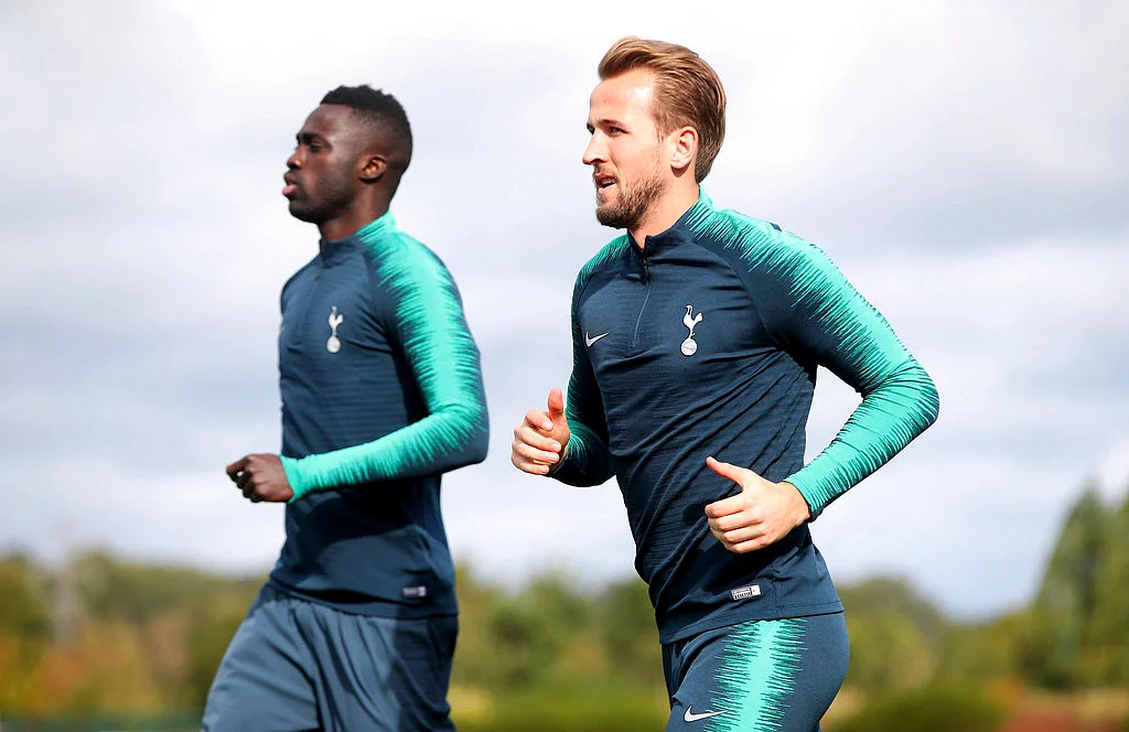 Tottenham Hotspur’s Harry Kane, foreground, and teammate Davinson Sanchez, run, during a training session.