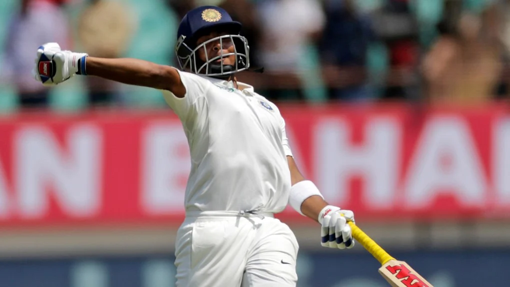India’s Prithvi Shaw celebrating after reaching his hundred against West Indies in the first Test in Rajkot.