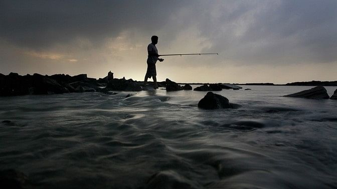 A fisherman catching fish in the Arabian Sea, Mumbai. Image used for representational purposes.