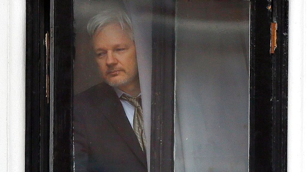 Wikileaks founder Julian Assange walks onto the balcony of the Ecuadorean Embassy in London.