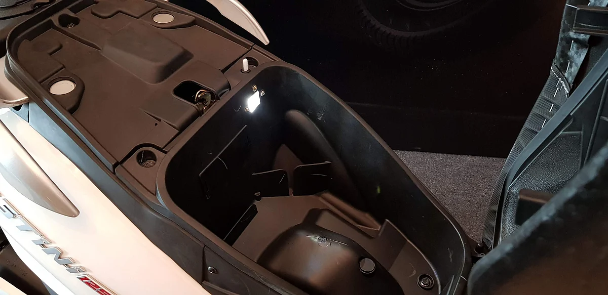 There is a boot lamp and USB port under the seat. 