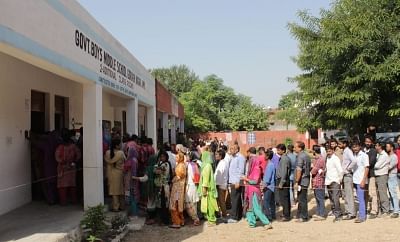 Jammu: People queue up outside a polling booth in Jammu during the first phase of Municipal polls in Jammu and Kashmir that is taking place after a gap of 13 years; on Oct 8, 2018. (Photo: IANS)