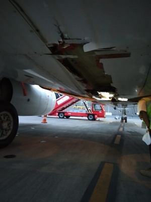 Mumbai: A view of damage part of the Air India Express flight, in Mumbai, on Oct 12, 2018.  Passengers onboard an Air India Express flight from Tiruchirappalli in Tamil Nadu to Dubai escaped a major accident after the wheels of the plane hit the airport outer wall while taking off. (Photo: IANS)