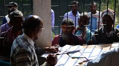 Villagers check their names as Assam government published the part draft of National Register of Citizens (NRC). Image used for representation.