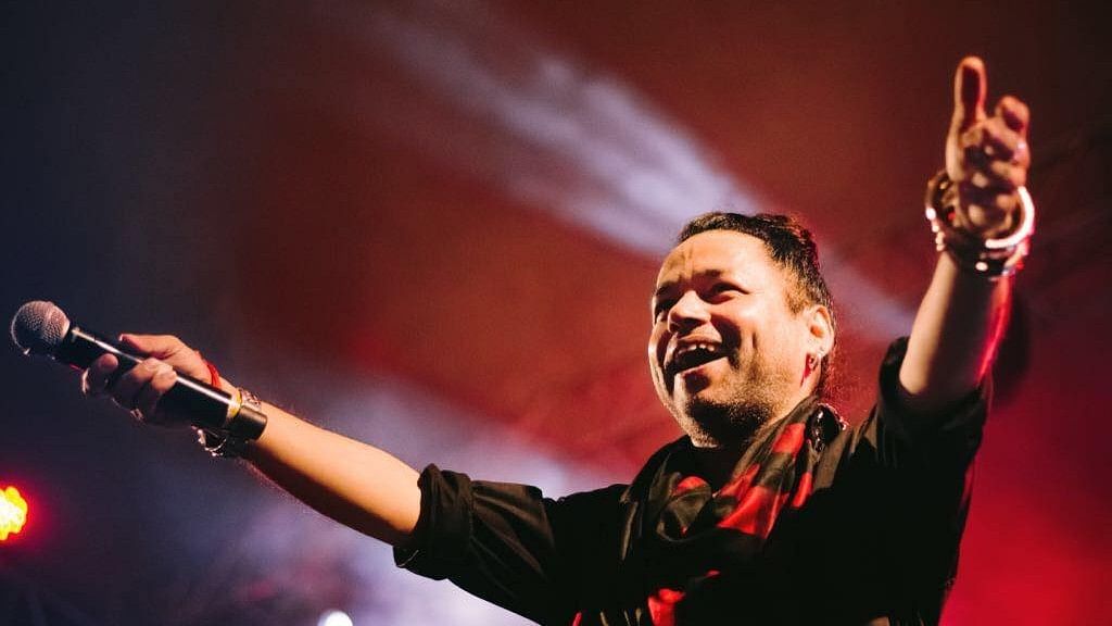 Kailash Kher performing at a concert.