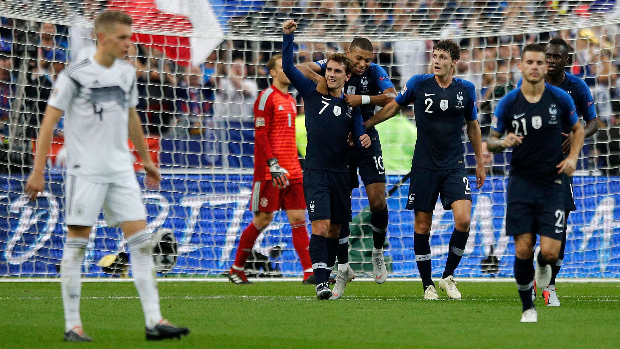 France’s Antoine Griezmann, center, clenches his fist after scoring his second goal during their UEFA Nations League soccer match between France and Germany.