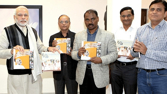 File photo from 2014. Gujarat Chief Minister Narendra Modi at the unveiling ceremony of the calendar for the year 2014. GC Murmu (center) also present.