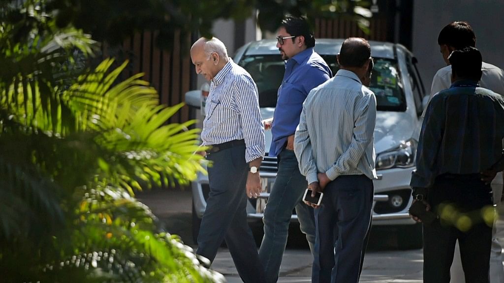 Union minister M J Akbar (L), who is facing allegations of sexual harassment by a number of women journalists, at his residence in New Delhi, Sunday, 14 October.&nbsp;