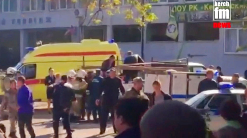 In this image made from the video, emergency services load an injured person onto a truck, in Kerch, Crimea, on Wednesday, 17 October 2018.