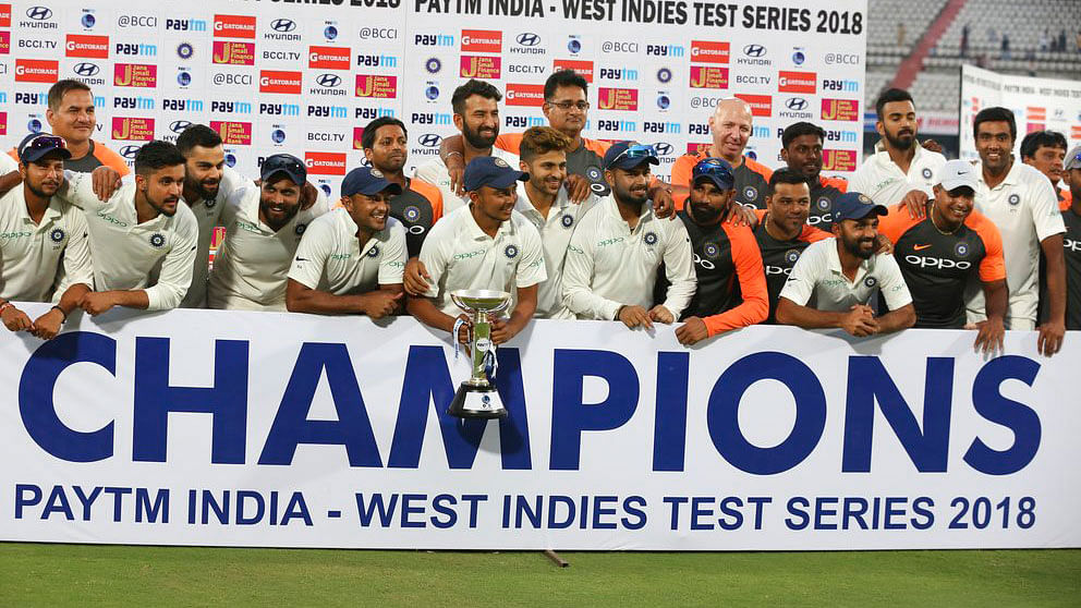 The Indian team celebrate after winning the Test series against West Indies.