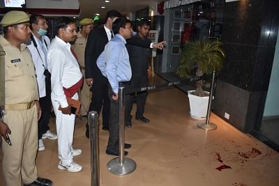 Varanasi: Police carry out investigations at the site where two persons were killed and two others injured when a man opened fire at them at a mall in Varanasi on Oct 31, 2018. The assailant fled the crime scene as frightened people ran for cover.The deceased have been identified as 26-year-old Gopi Kanaujia (salesman) of a showroom in the JHV Mall where the incident took place and Sunil Gaur (tailor), 45. Their bodies have been sent for post-mortem examination.(Photo: IANS)