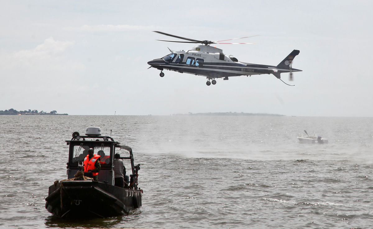 Ugandan diving teams are retrieving bodies from Lake Victoria where police say at least 30 people.