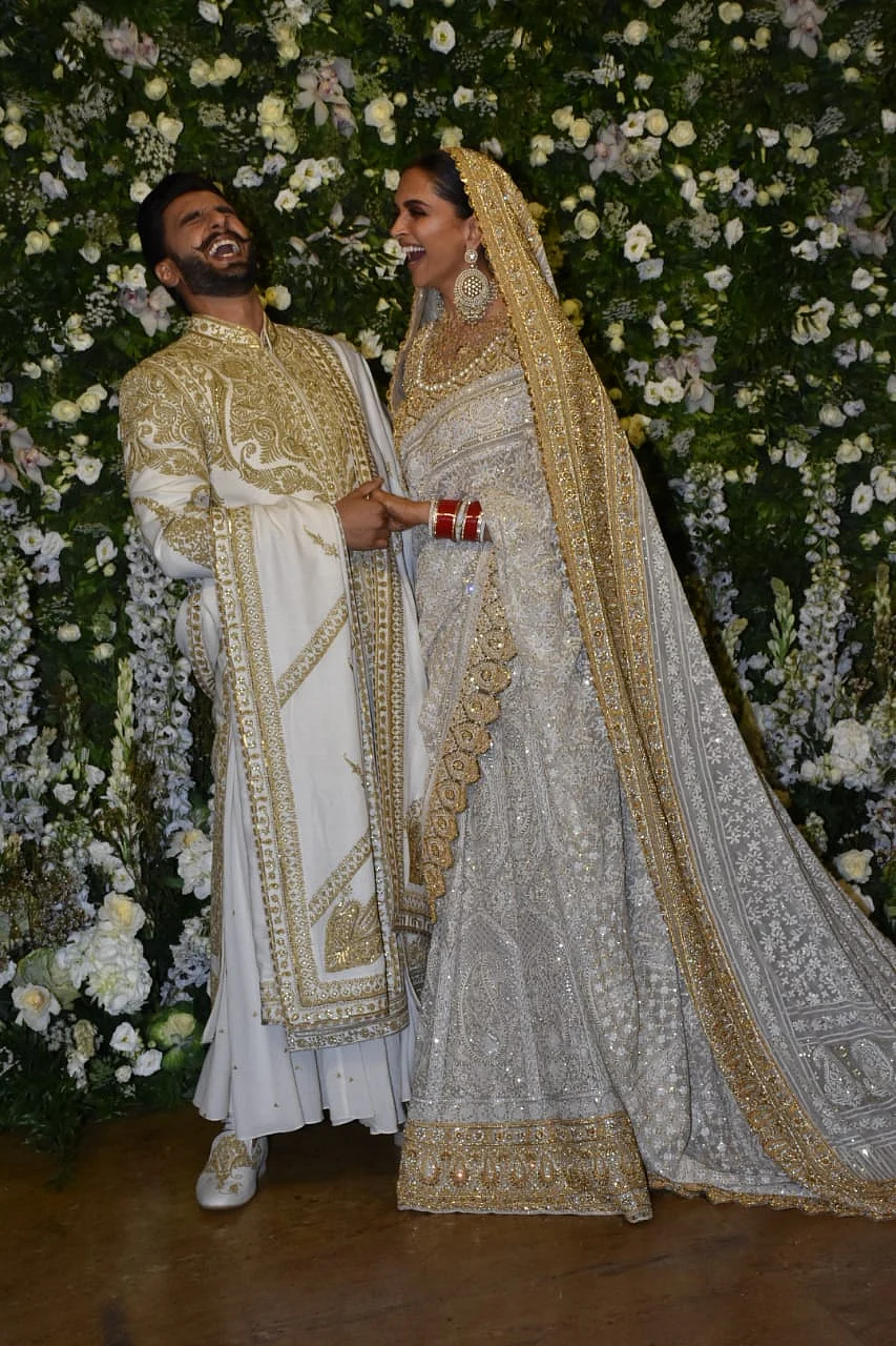 The newly weds share a laugh together.