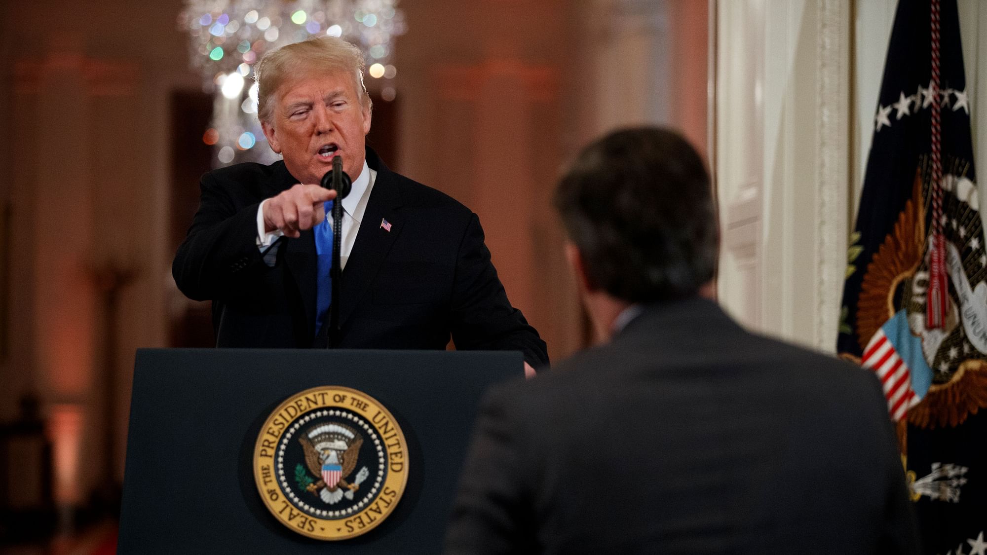 President Donald Trump speaks to CNN journalist Jim Acosta during a news conference.