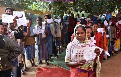 Konta: Voters queue up outside a polling booth during the 1st phase of Chhattisgarh Assembly Elections in Konta on Nov 12, 2018. (Photo: IANS/PIB)