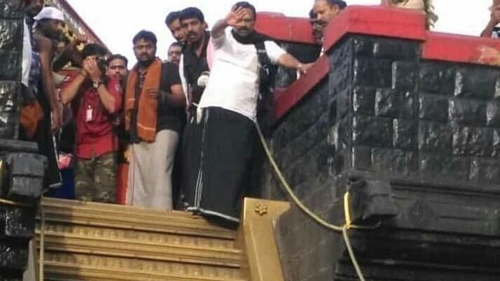 RSS leader Valsan Thillankeri breaks Sabarimala rituals by by climbing the sacred steps of the shrine without carrying the customary ‘Irumudi Kettu’.