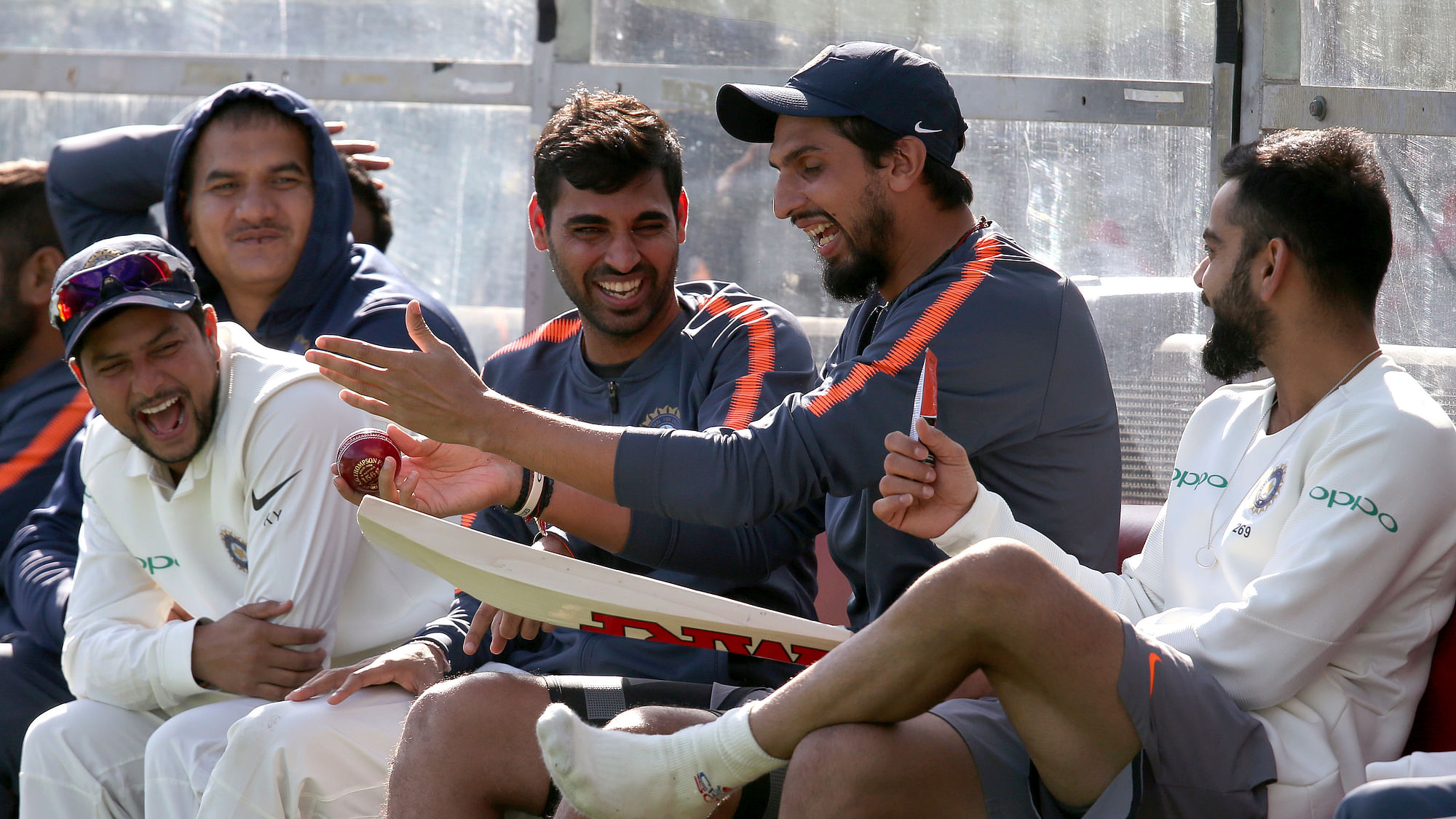 Indian cricketers enjoy a light moment in the dugout during a warm-up game between India and Cricket Australia XI.