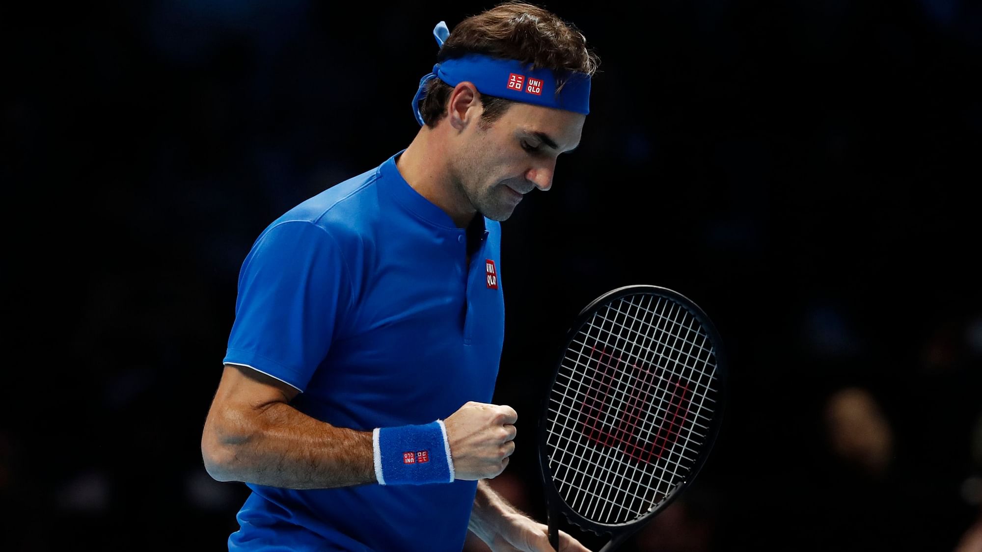 Roger Federer celebrates a point during his win over Dominic Thiem at the ATP Finals