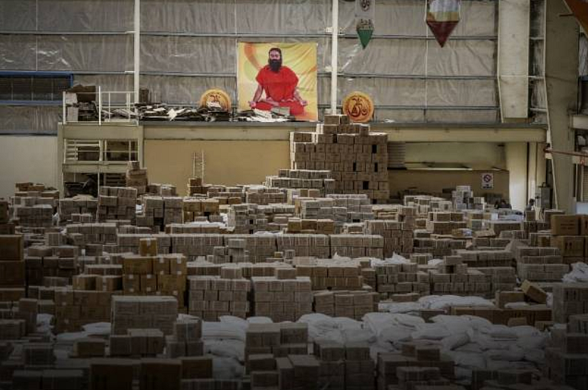 A poster depicting yoga guru Baba Ramdev is displayed inside a warehouse operated by Patanjali Ayurved Ltd. near to the Multi-modal International Cargo Hub Airport at Nagpur (MIHAN) in Nagpur.