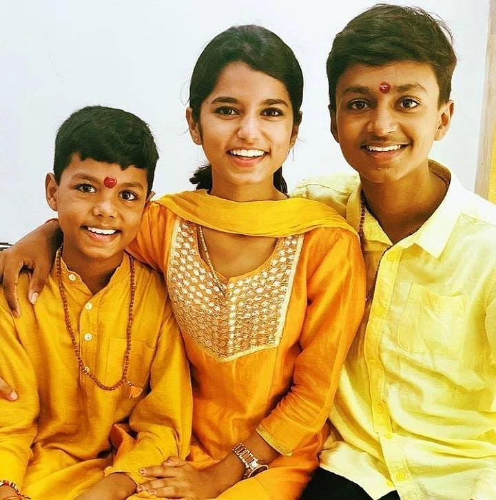 Maithli with her younger brothers, Rishav and Ayachi.