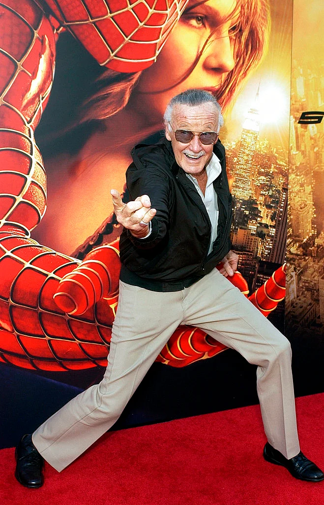 In this 22 June 2004 photo, Spiderman creator and <i>Spider-Man 2</i> executive producer Stan Lee poses for photographers at the premiere of “Spider-Man 2” in Los Angeles. 