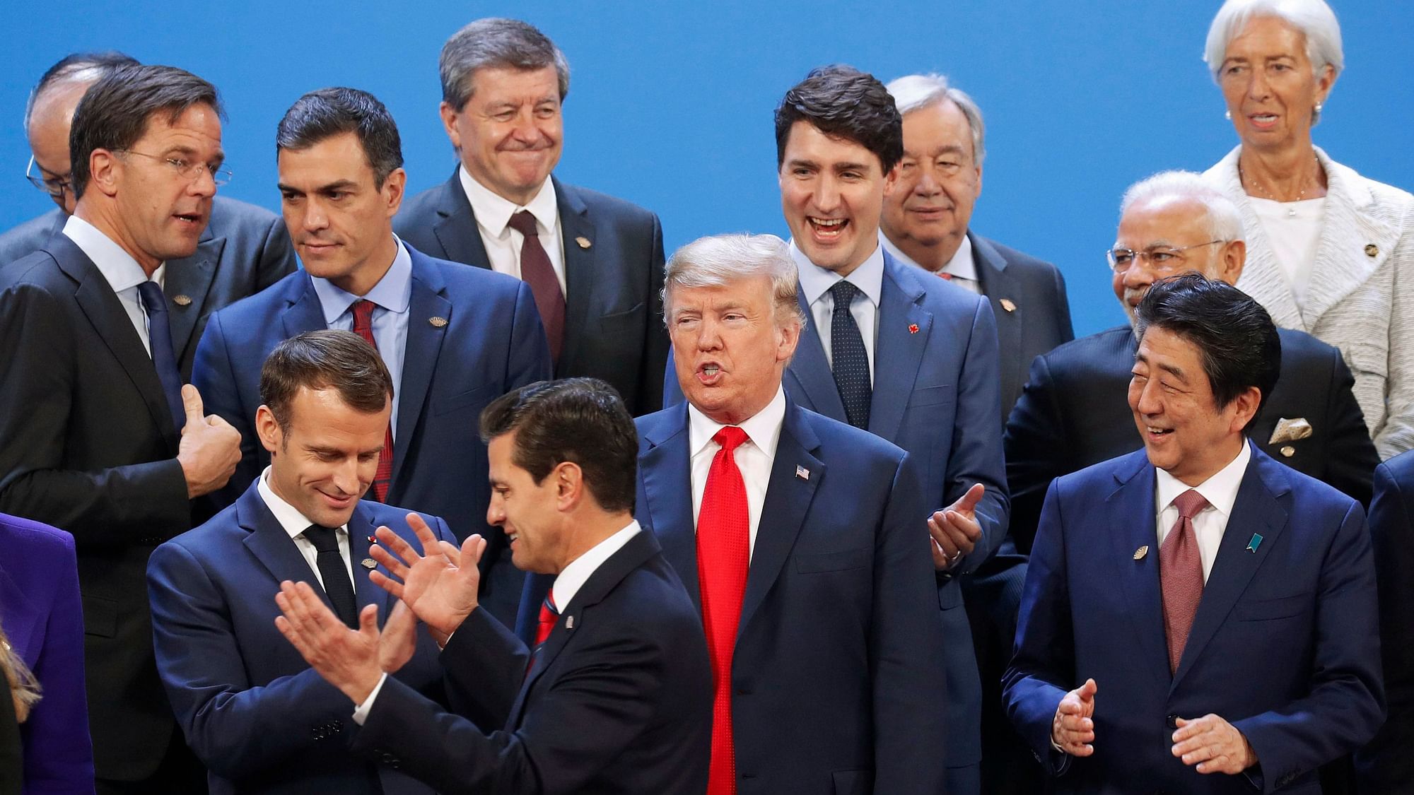 US President Donald Trump and other heads of state react to Mexico’s President Enrique Pena Neto being the last one to arrive for the family photo at the G20 summit on 30 November.