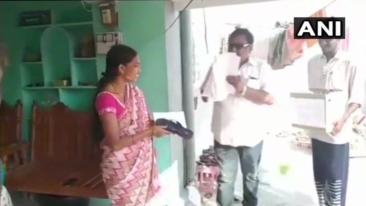 Candidate in Telangana distributing slippers to voters in Jagtial district.