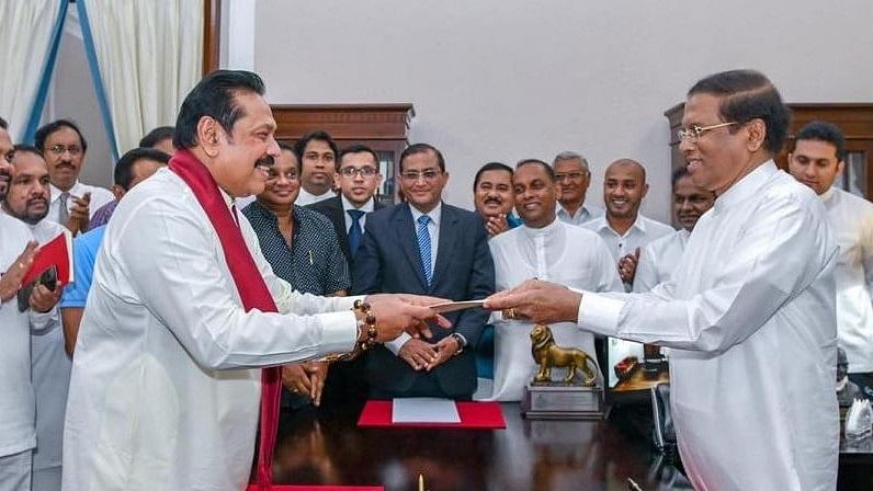 Former Sri Lankan President Mahinda Rajapaksa sworn in as new Prime Minister by President Maithripala Sirisena, in Colombo, on 26 October, 2018.