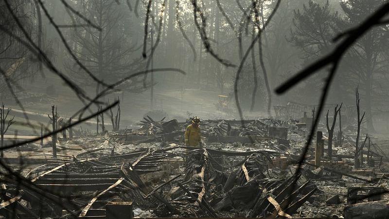 Authorities in Northern California on Friday searched for those who perished and those who survived the fiercest of wildfires ahead of a planned visit by President Donald Trump.