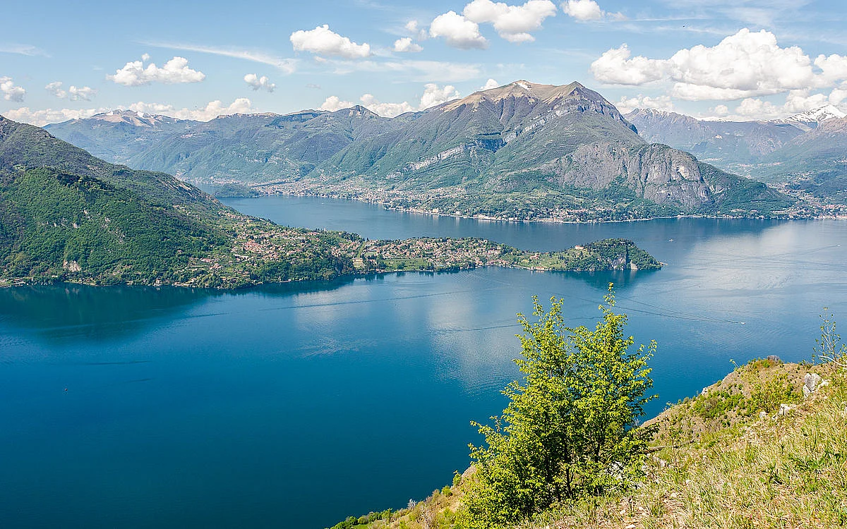 The blue waters of Lake Como with the Alps in the background.