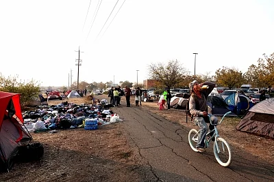 CHICO, Nov. 19, 2018 (Xinhua) -- Victims of the Camp Fire live in tents at the parking area of Walmart in Chico of Butte County, California, the United States, Nov. 18, 2018. The death toll from the massive wildfire in Northern California, dubbed the Camp Fire, has climbed to 77, said authorities on Sunday evening. (Xinhua/Wu Xiaoling/IANS)
