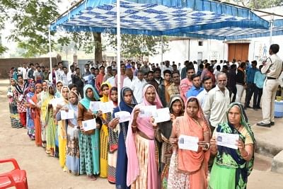 Mandsaur, Madhya Pradesh: People wait in a queue to cast their vote for Madhya Pradesh assembly elections at Mandsaur in Madhya Pradesh on Nov. 28, 2018. (Photo: IANS)