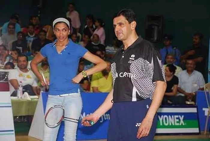 Deepika leaning badminton fro her coach and father Prakash Padukone.