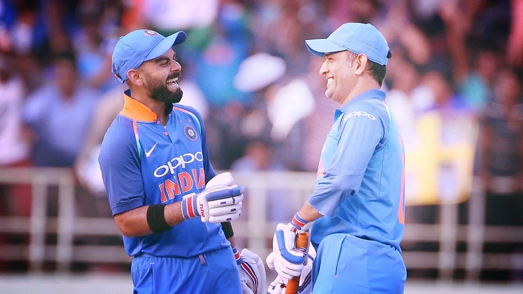 Virat Kohli and MS Dhoni share a laugh during India’s 2nd ODI against West Indies at Visakhapatnam.