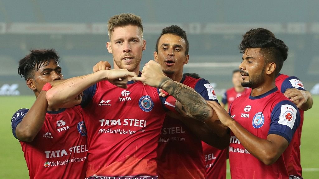 Tiri of Jamshedpur FC celebrates with the much needed equalizing goal with the team players in a on road match in Hero ISL