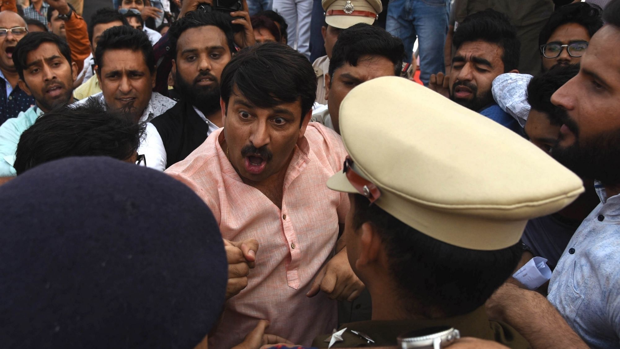 Delhi BJP chief Manoj Tiwari argues with the police during a scuffle with Aam Aadmi Party (AAP) workers at the inauguration of the Signature Bridge over Yamuna river, in New Delhi on 4 November, 2018.