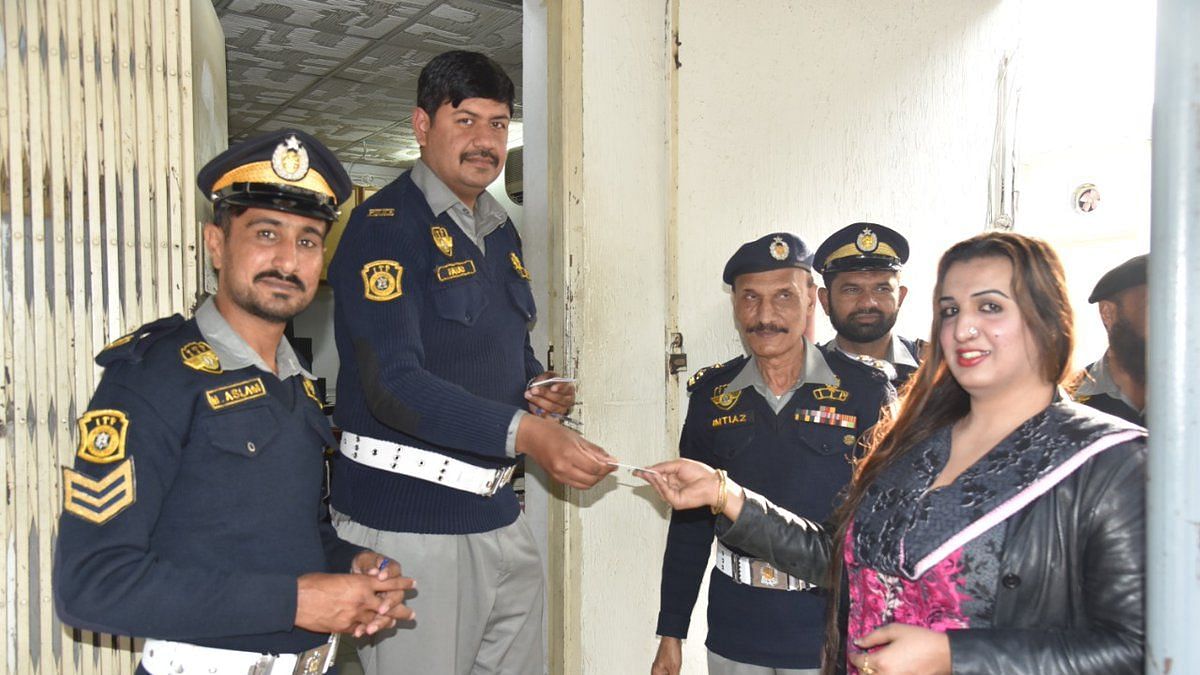 Laila Ali receives her license from the Islamabad Traffic Police.