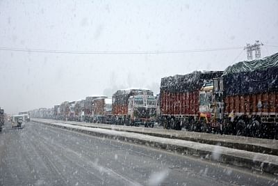 Qazigund: A queue of stranded trucks on Srinagar-Jammu Highway during snowfall in Qazigund of Jammu and Kashmir