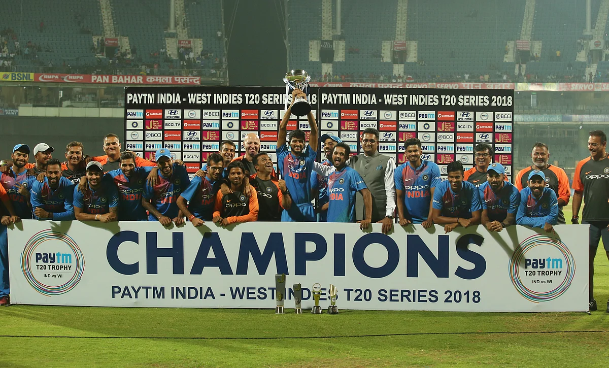 Members of the Indian cricket team pose with the winners trophy after their win in the third and last Twenty20 international cricket match against West Indies in Chennai, India, Sunday, Nov. 11, 2018. India won the series 3-0. 