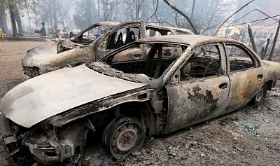 PARADISE, Nov. 14, 2018 (Xinhua) -- Destroyed cars are seen after the wildfire in Paradise, California, the United States, on Nov. 13, 2018. The death toll from the raging Camp Fire in the U.S. state of California has increased to 48 as rescuers continue to search for missing residents in and around the town of Paradise, local authorities said Tuesday. (Xinhua/Li Ying/IANS)