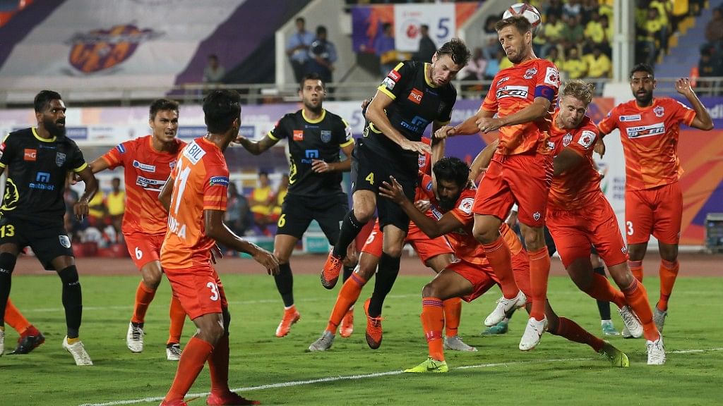 FC Pune City and Kerala Blasters FC vie for the ball during a match in Hero ISL