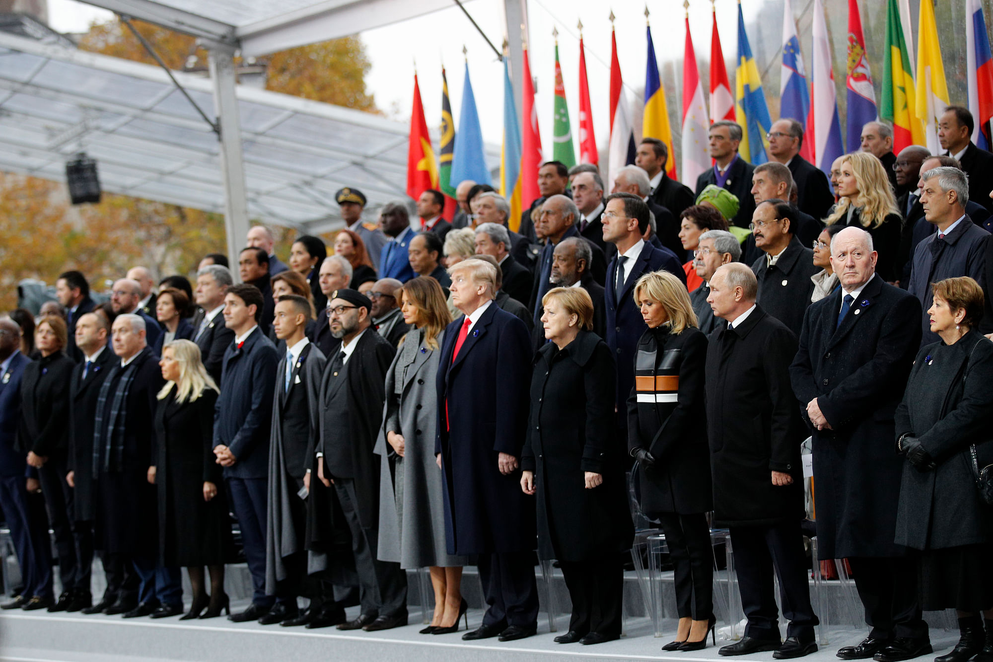 Heads of states and world leaders attend ceremonies at the Arc de Triomphe in Paris. 