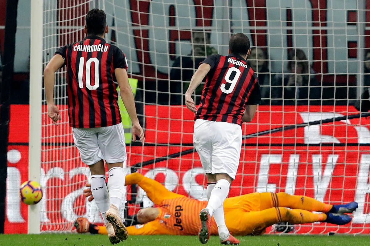 AC Milan forward Gonzalo Higuain (No. 9) misses a penalty against former club Juventus