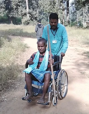 Sukma: A wheel chair bound voter being assisted to a polling booth during the 1st phase of Chhattisgarh Assembly Elections, in Sukma on Nov 12, 2018. (Photo: IANS/PIB)