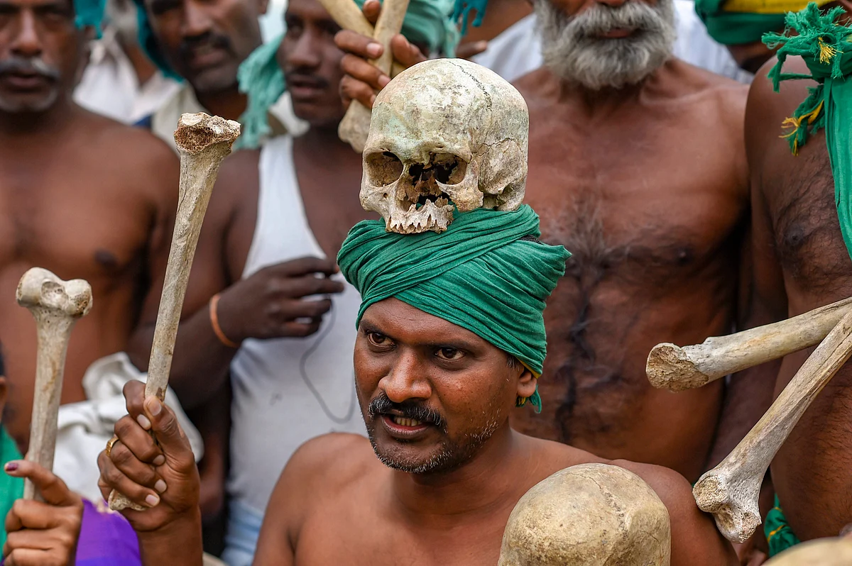 A farmer from Tamil Nadu displays human skulls and bones during a protest ahead of their march towards Parliament, at Ramlila Maidan in New Delhi, Friday, 30 Nov., 2018. 