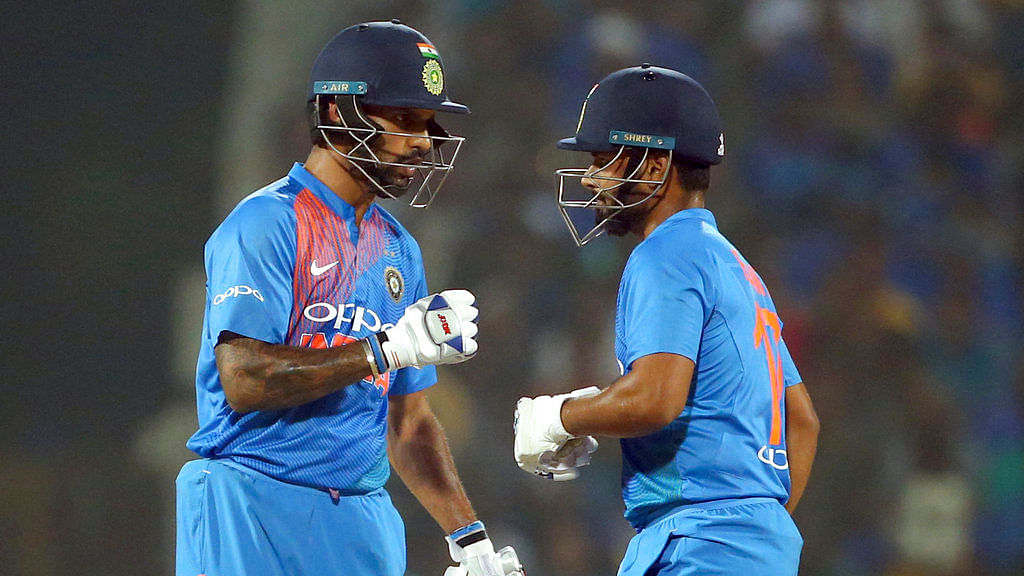 Shikhar Dhawan, left, and Rishabh Pant interact in the middle during the third T20I against West Indies.