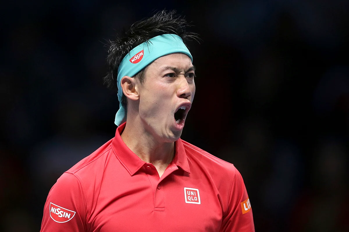 Kei Nishikori celebrates his first win over Roger Federer in seven matches since 2014