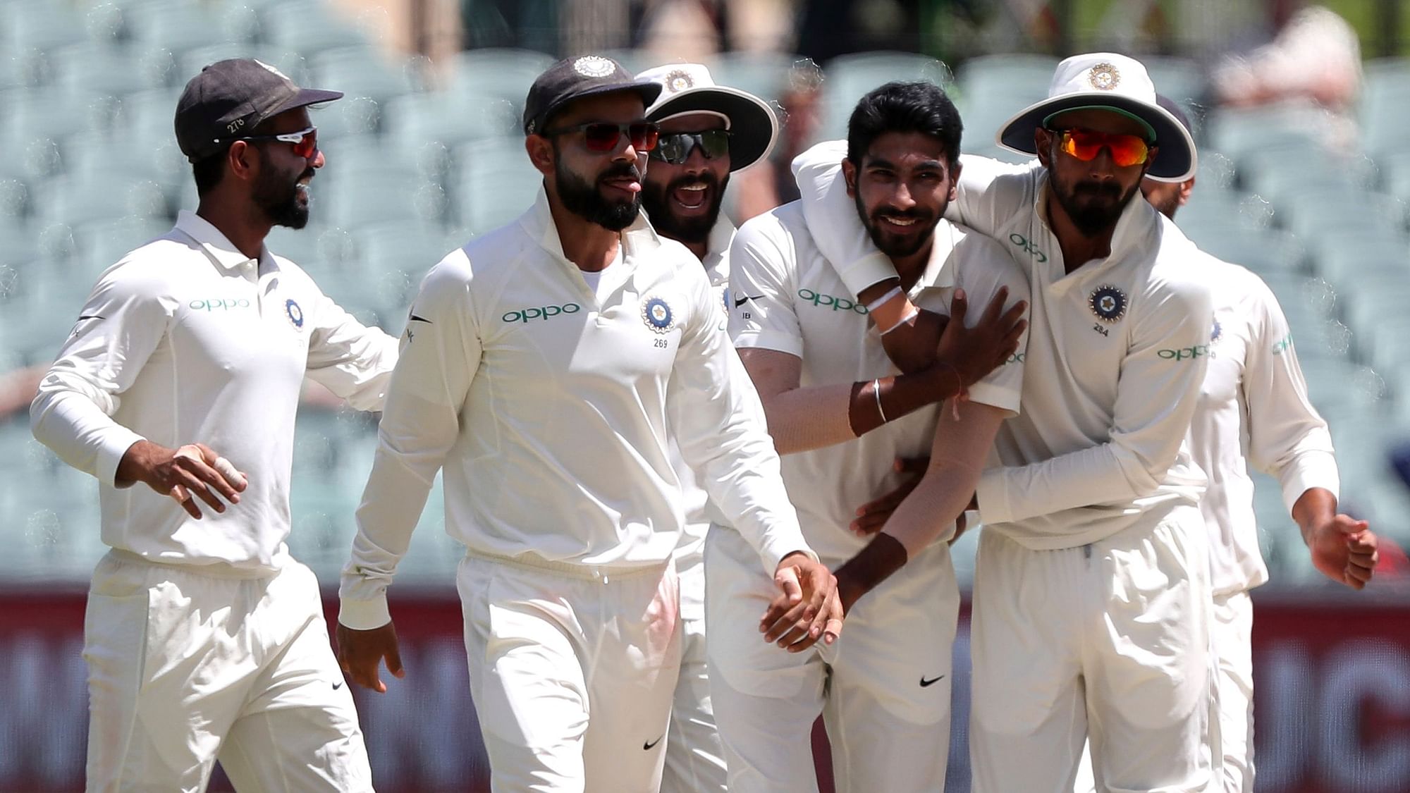 India’s Jasprit Bumrah, second right, is congratulated by teammates after dismissing Australia’s Shaun Marsh during the first cricket Test between Australia and India.